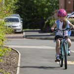 Child riding a bike to school