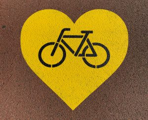 A bike within a heart in some road art