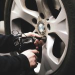 A technician fixing a car tyre